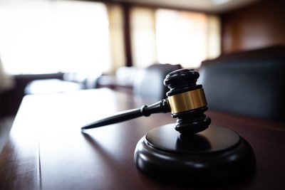 Wooden court gavel on wood table in courtroom,judge and trial. auction. law and justice, legality concept, judge.